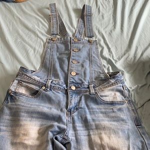 Blue jean overalls. skinny leg